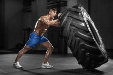 Muscular-man-working-out-in-gym-flipping-tire.jpg Muscular-man-working-out-in-gym-flipping-tire.jpg